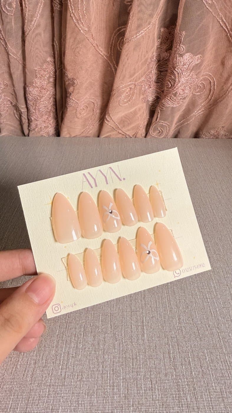 Pearl Bow — Design #10 press-on nails by AYYN. PKR 600